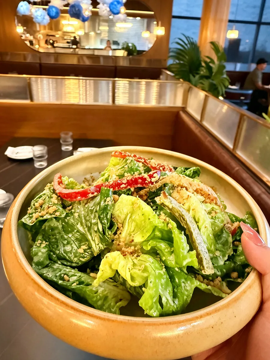 Fresh romaine salad with red peppers and crunchy topping at 21 Raw Bar Taphouse & Grill, a Seafood Restaurant in Greenville