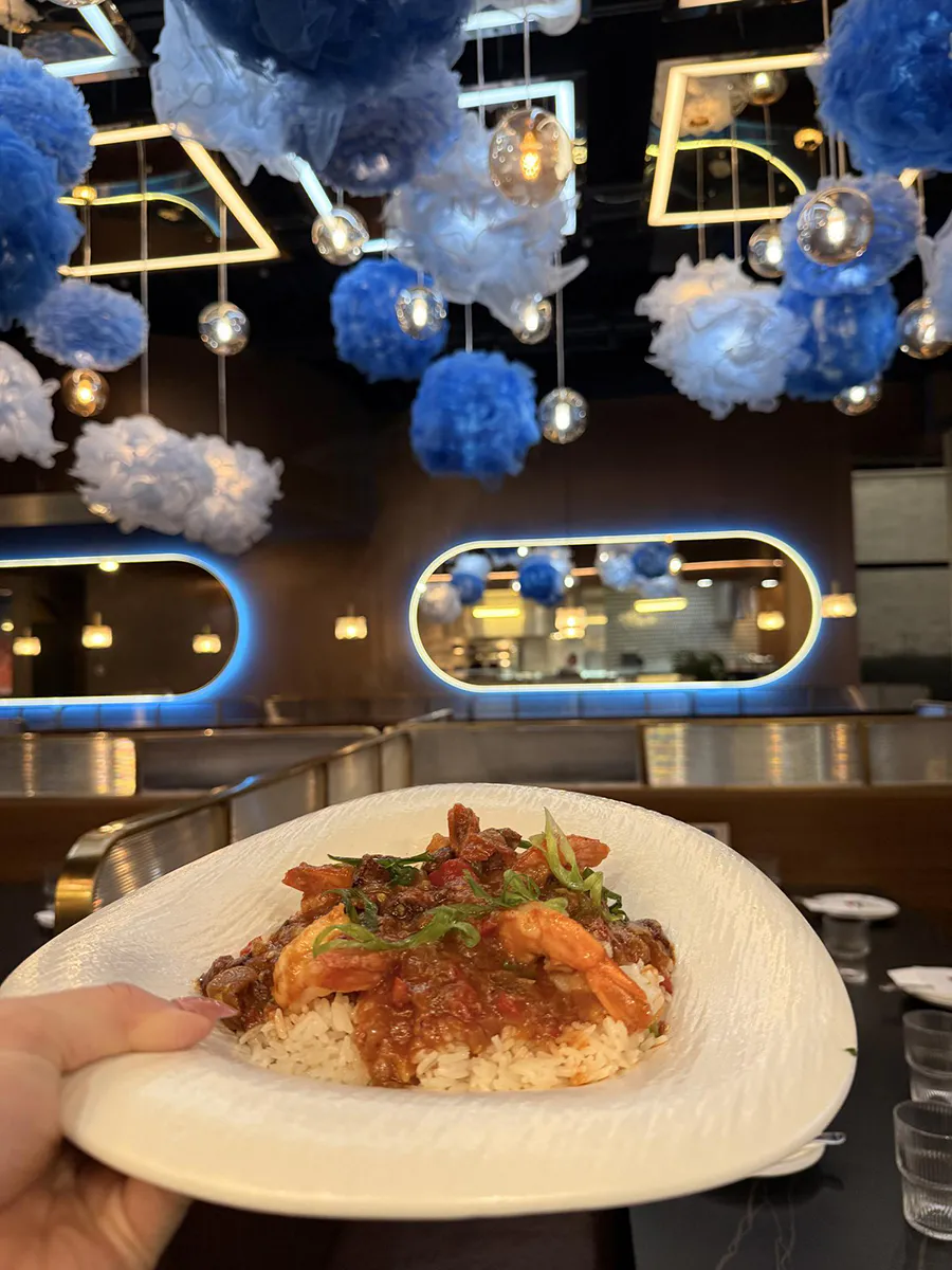 Cajun-style seafood and rice dish with shrimp and savory sauce at 21 Raw Bar Taphouse & Grill, a Seafood Restaurant in Greenville